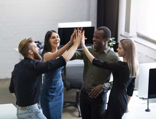 group-of-young-colleagues-giving-each-other-high-five